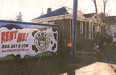 The enthusiastic COW outside of the Bellingham Historical Museum is part of a storage container the Historical Commission is using while the basement is being repaired. [DAILY NEWS PHOTO BY MORGAN ROUSSEAU]