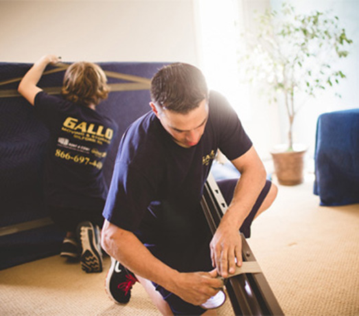 movers in Franklin MA getting furniture packed and ready to move